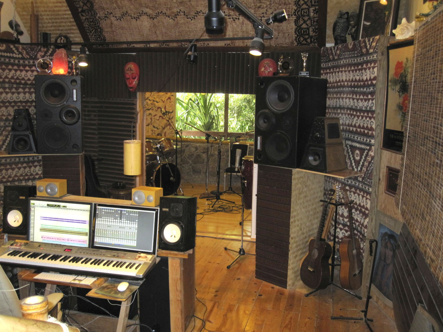 Recording studio control room with monitors and keyboard