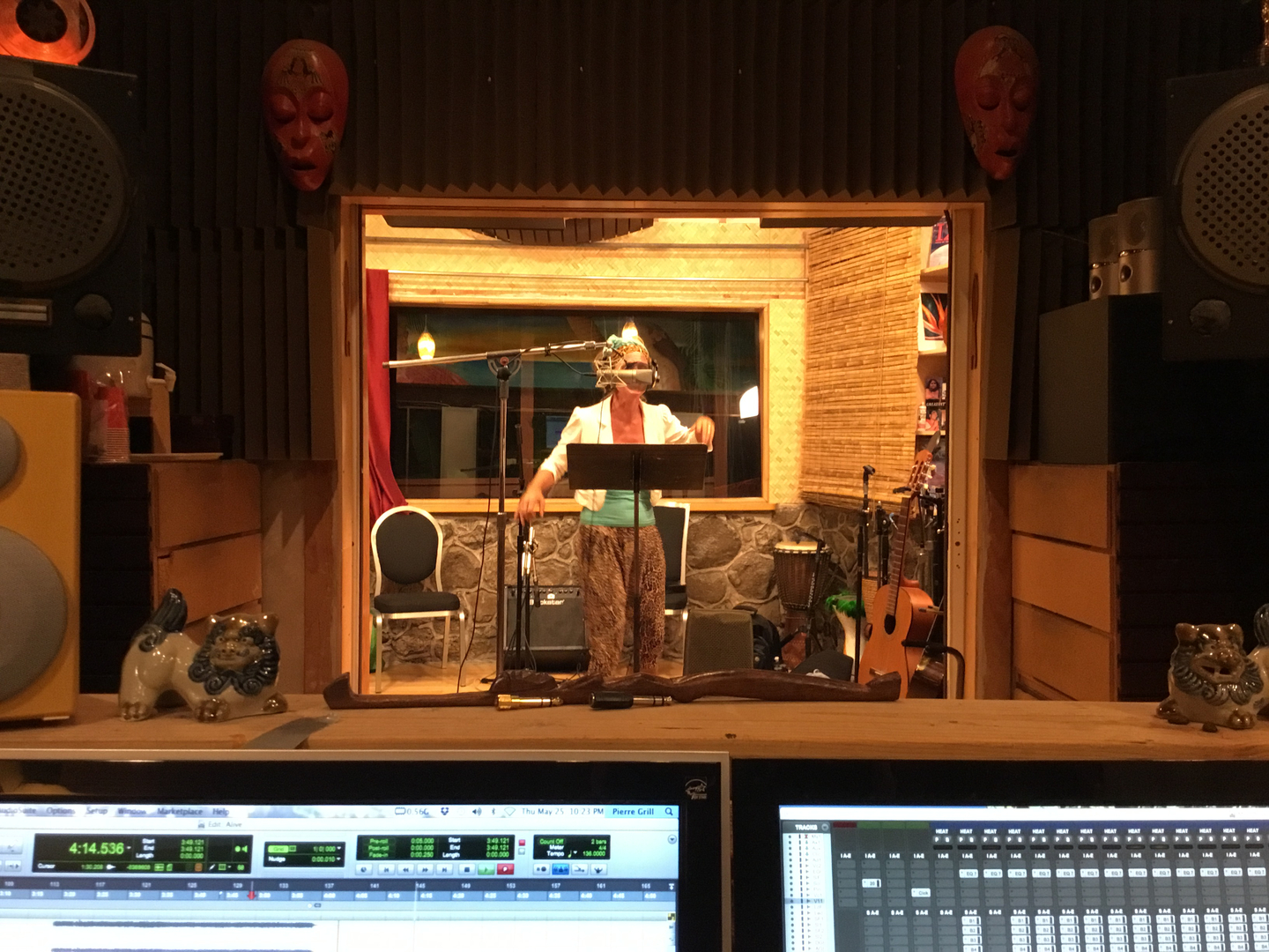 Studio engineer and client in recording studio